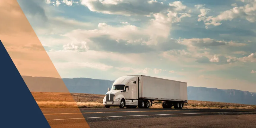 white tractor trailer on a rural highway